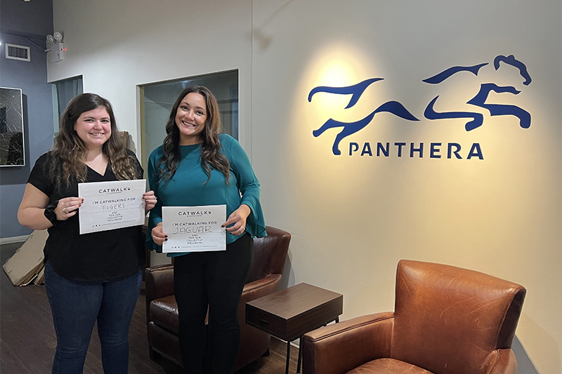 "Women holding signs"