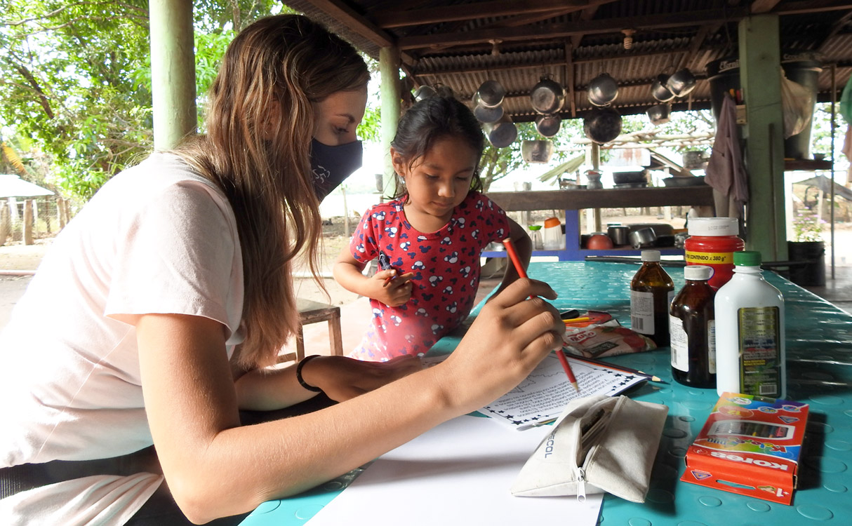 Teacher and student collaborating