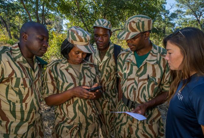 Conservationist, Xia Stevens, teaching anti-poaching scouts about SMART program, Sioma, western Zambia